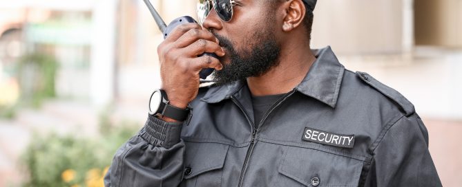 Capital Security Force Guard Speaking into Radio.